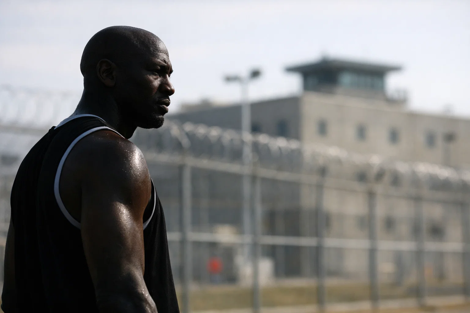 Michael Jordan prison investment fact check showing athlete silhouette and private prison facility in background