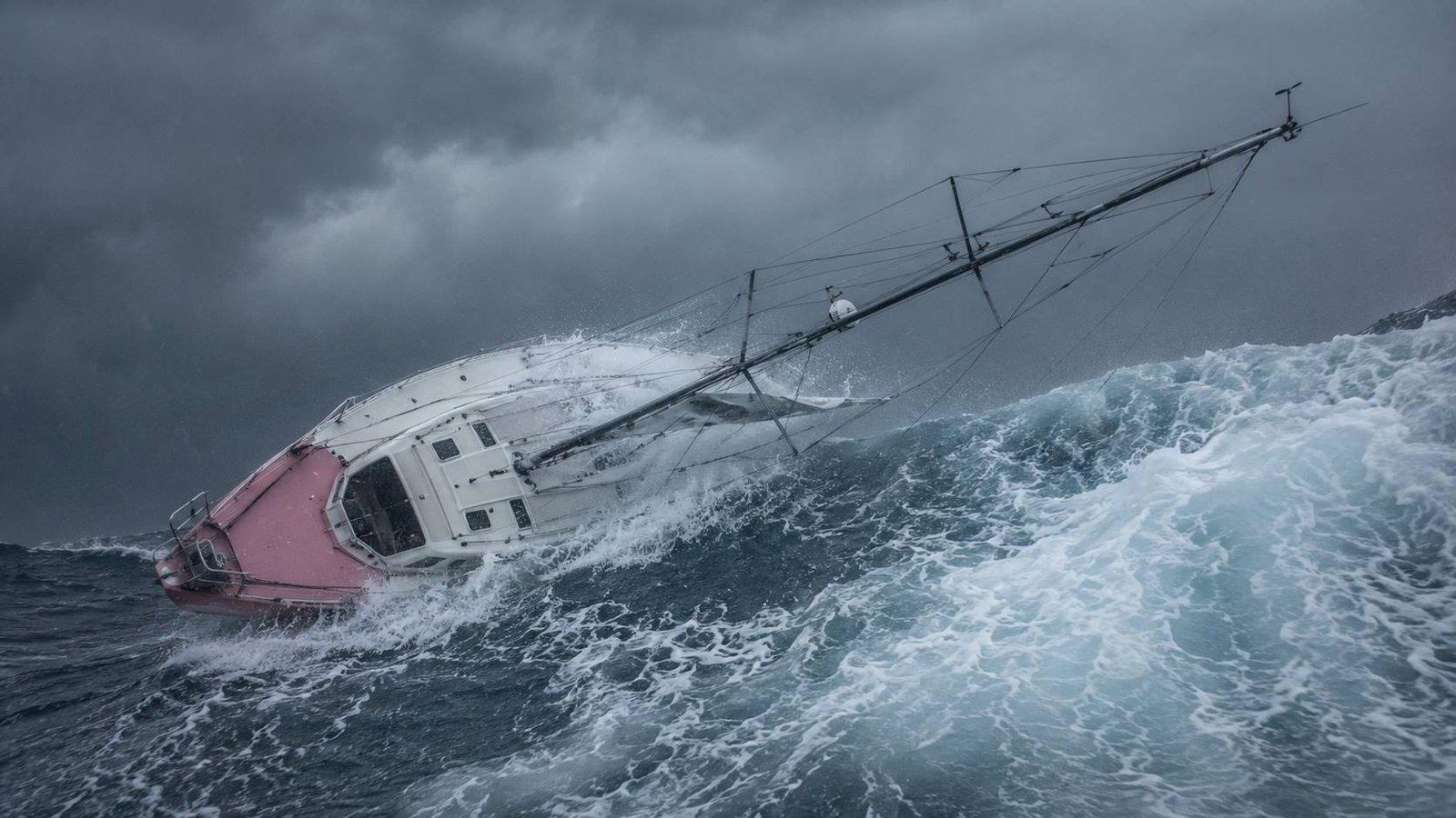 Jessica Watson’s pink yacht rolling in the storm shown in the True Spirit true story.
